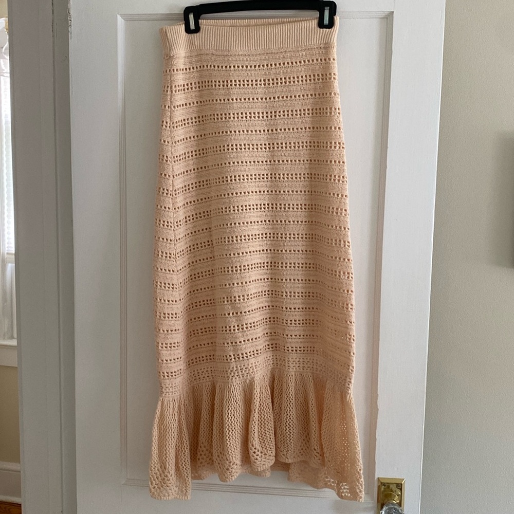 Ivory knit skirt with heart detail. Can also be worn as a dress.